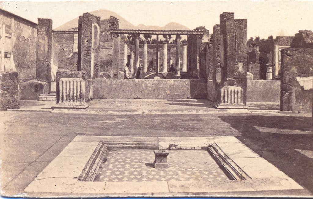 VI.12.2 Pompeii. Between 1867 and 1874.
Looking north across impluvium in atrium, towards tablinum 33. Photo by Sommer and Behles. Photo courtesy of Charles Marty.
Found in the rooms on either side of the tablinum were floor mosaics.
According to Fiorelli, in the room on the left of the tablinum, giving access through to the peristyle, was found a mosaic of Bacchus on a panther.
In the room on the right of the tablinum, was found a floor mosaic of a sea of fishes.
See Pappalardo, U., 2001. La Descrizione di Pompei per Giuseppe Fiorelli (1875). Napoli: Massa Editore, (p.71).