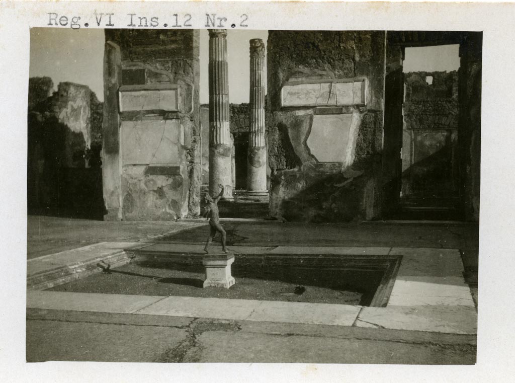 VI.12.2 Pompeii. pre-1937-39.
Looking east across impluvium in atrium towards doorway to ala 11 into atrium of VI.12.5, in centre.
On the right is the doorway to a cubiculum 10.
Photo courtesy of American Academy in Rome, Photographic Archive. Warsher collection no. 1416