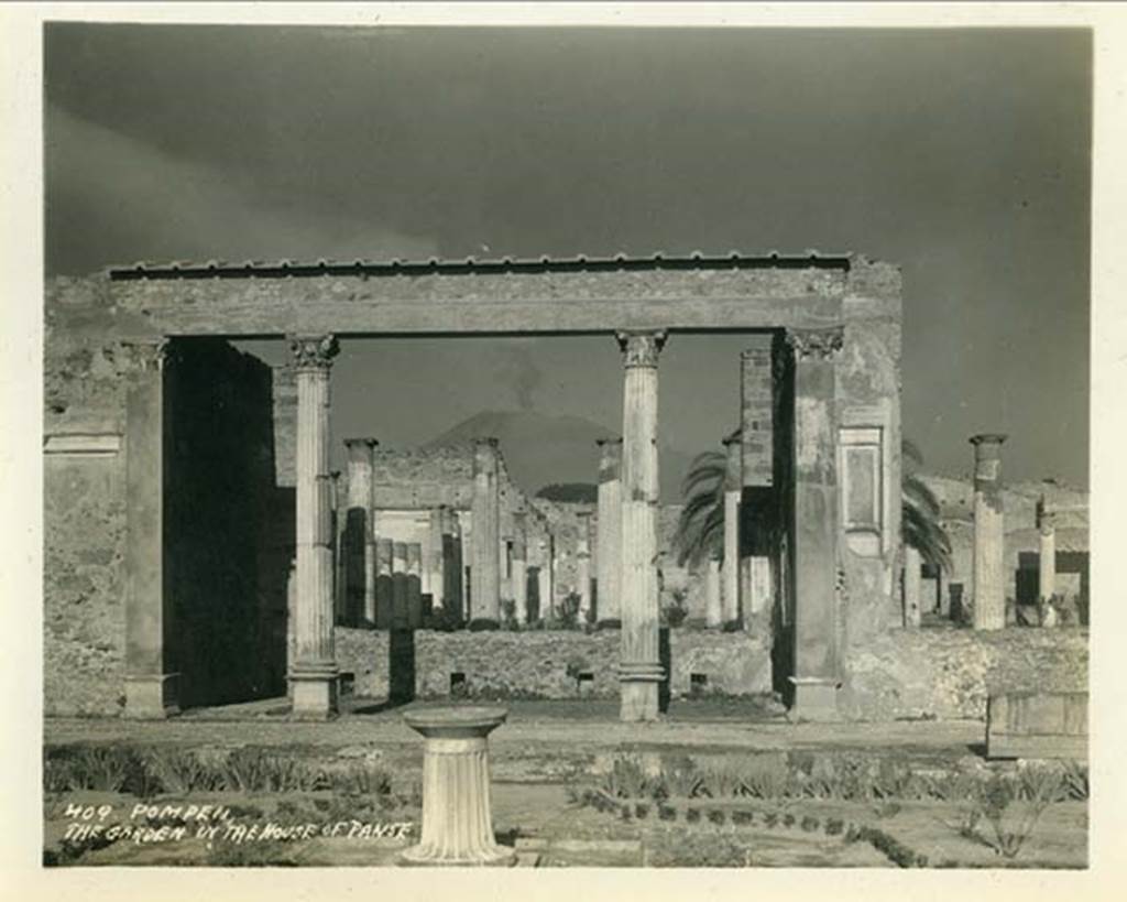 VI.12.2 Pompeii. 1932. Looking north from first garden across exedra to rear peristyle.
(Note: the photo has the wrong location being described as “The garden of the House of Panse”).  Photo taken during a shore-visit from the ship Resolute’s world cruise in 1932. Photo courtesy of Rick Bauer.
