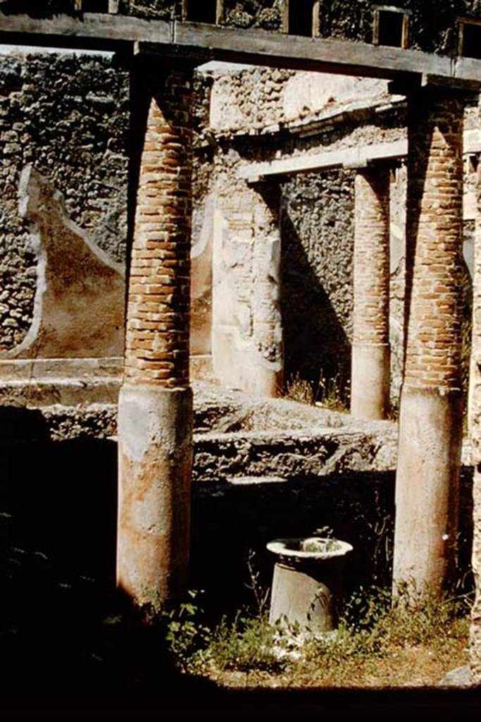 VI.14.22 Pompeii. 1959. Room 12, looking north-west from rear of tablinum, (original peristyle), across rinsing basins. The puteal for the cistern opening can be seen on the eastern side of the vats/basins. Photo by Stanley A. Jashemski.
Source: The Wilhelmina and Stanley A. Jashemski archive in the University of Maryland Library, Special Collections (See collection page) and made available under the Creative Commons Attribution-Non Commercial License v.4. See Licence and use details.
J59f0422