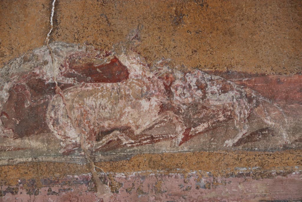 VI.15.1 Pompeii. October 2023.
North wall of atrium, detail from lower panel below above three photos, above site of strongbox. Photo courtesy of Klaus Heese.