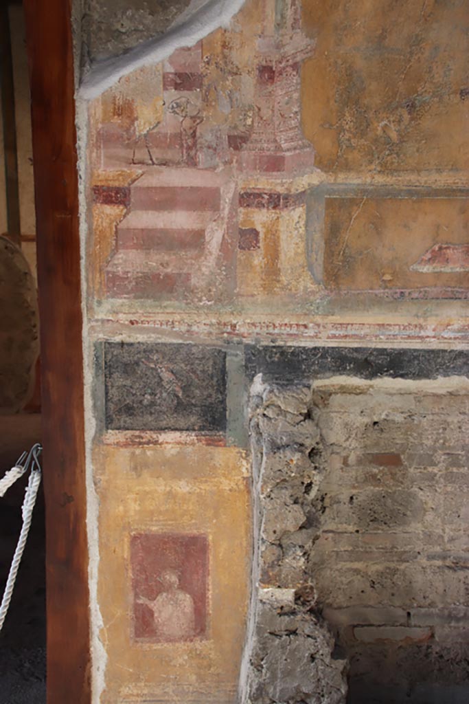 VI.15.1 Pompeii. October 2023.
North wall of atrium, painted decoration from west side of masonry base for strongbox Photo courtesy of Klaus Heese.