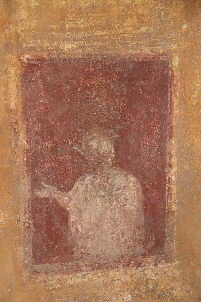 VI.15.1 Pompeii. October 2023.
Detail from lower north wall of atrium, painted decoration from west side of masonry base for strongbox.
Photo courtesy of Klaus Heese.