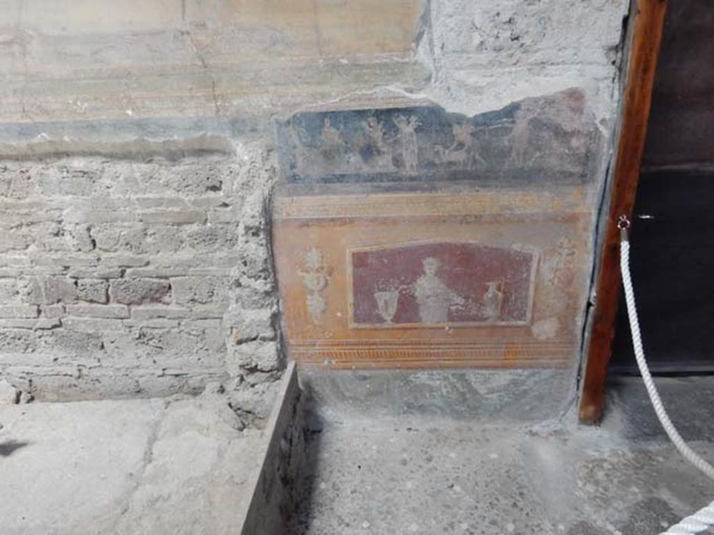 VI.15.1 Pompeii. May 2017. North side of atrium, painted panels on east side of masonry base for strongbox. Photo courtesy of Buzz Ferebee.