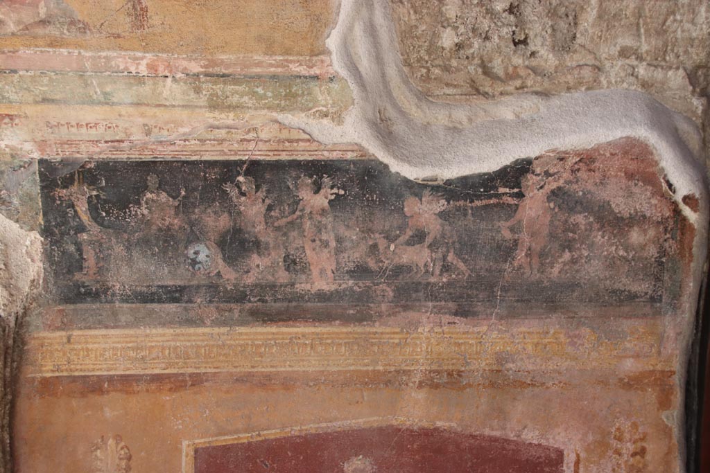 VI.15.1 Pompeii. October 2023.
North side of atrium, detail of painted panel on east side of masonry base for strongbox. Photo courtesy of Klaus Heese.