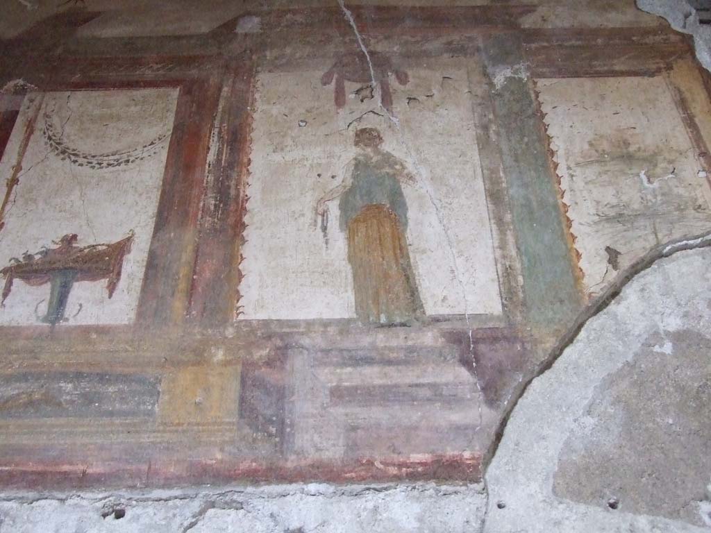 VI.15.1 Pompeii. December 2006. Detail of painting at upper north end of west wall in oecus.