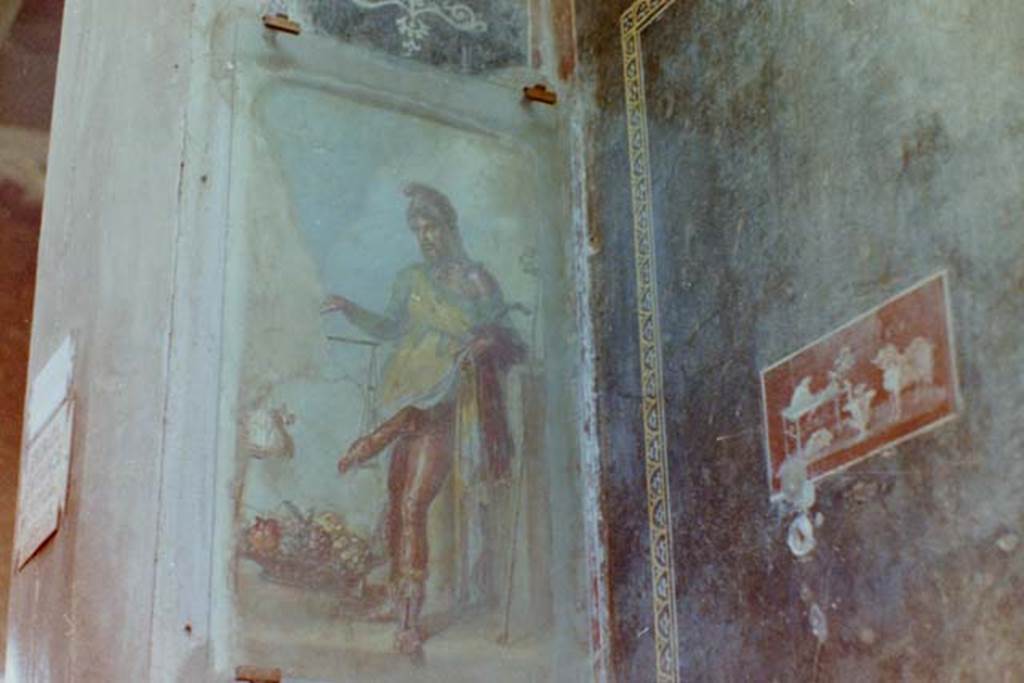 VI.15.1 Pompeii. 4th April 1980, pre earthquake. Painting of a bearded Priapus in vestibule. Photo courtesy of Tina Gilbert.