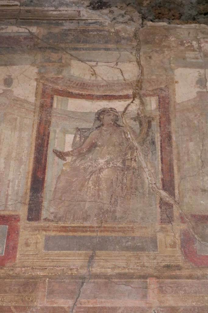 VI.15.1 Pompeii. December 2018. 
Detail of painting in centre on upper east wall of exedra. Photo courtesy of Aude Durand.
