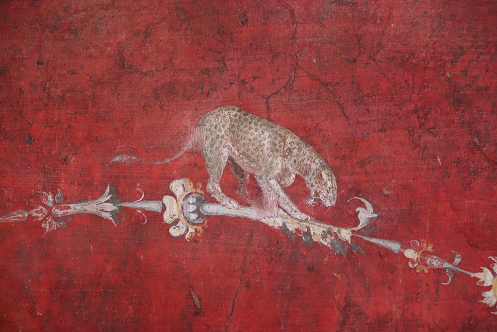 VI.15.1 Pompeii. October 2024. South wall of exedra, detail of painted decoration below central panel. Photo courtesy of Klaus Heese.