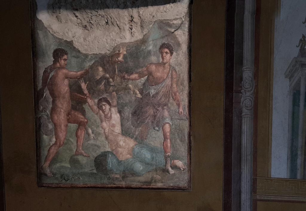 VI.15.1 Pompeii. January 2023.
South wall of exedra with central painting of the punishment of Dirce. Photo courtesy of Miriam Colomer.