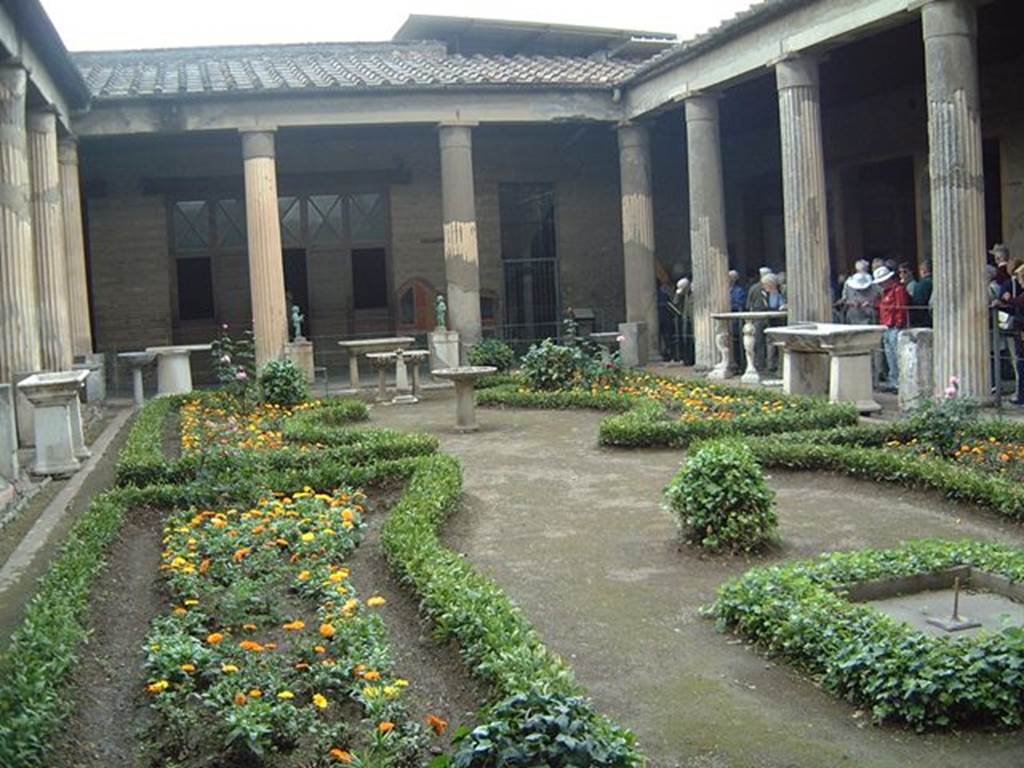 VI.15.1 Pompeii. Peristyle. View of garden looking north in May 2001. Photograph courtesy of Current Archaeology.
According to Jashemski,
“water from 12 fountain statuettes (2 bronze and 10 marble) on bases placed between the columns of the portico, jetted into 8 marble basins which stood in the water channel at the edge of the garden. 9 of the fountain statuettes were preserved and used to be on display in the garden. In 1978, the 4 fountain statuettes from the north end of the garden were stolen, eventually being recovered, but in pieces. The remaining statuettes were removed for safe keeping".
See Jashemski, W. F., 1993. The Gardens of Pompeii, Volume II: Appendices. New York: Caratzas. (p.153-54)