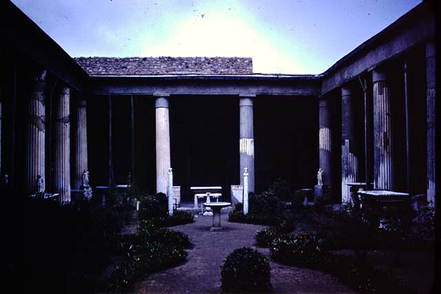 VI.15.1 Pompeii. December 2006. Looking east along north wall of peristyle.