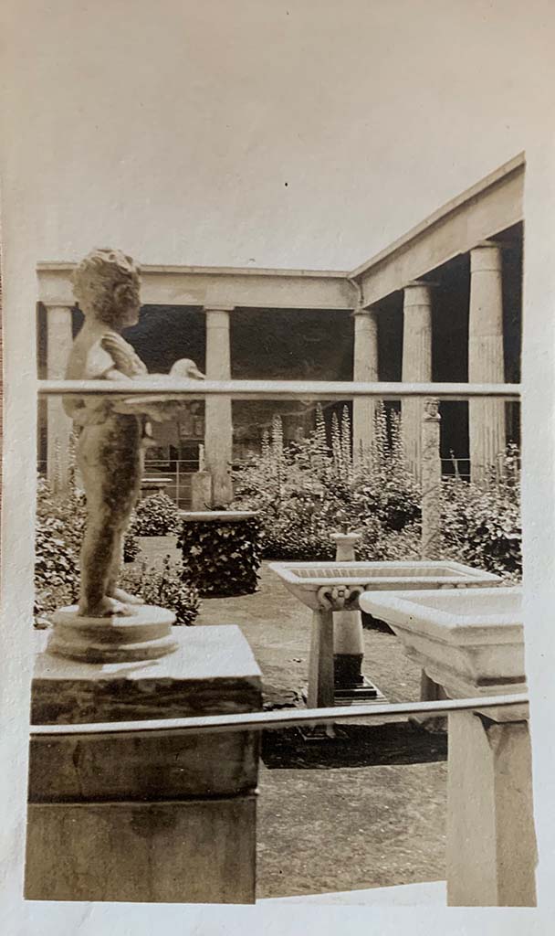 VI.15.1 Pompeii. 1907. North side of peristyle, looking south across garden area.
Bronze garden fountain statuette of boy, bird and grapes.
Photo courtesy of Rick Bauer.