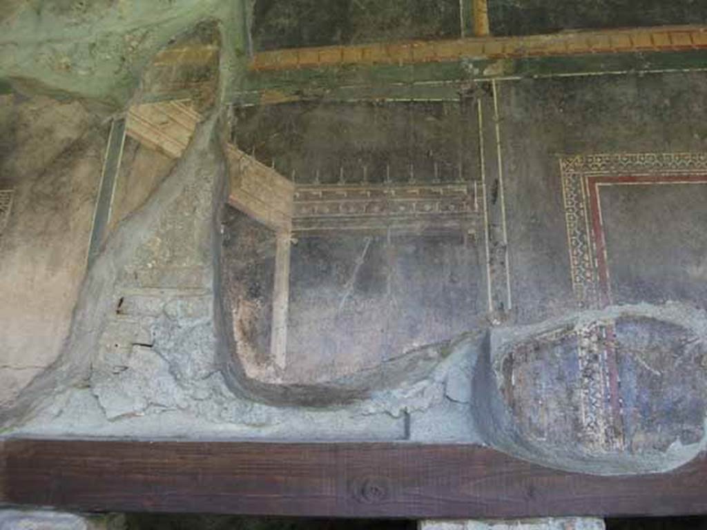 VI.16.7 Pompeii. May 2010. Room F, north portico, detail from upper wall above room L.
