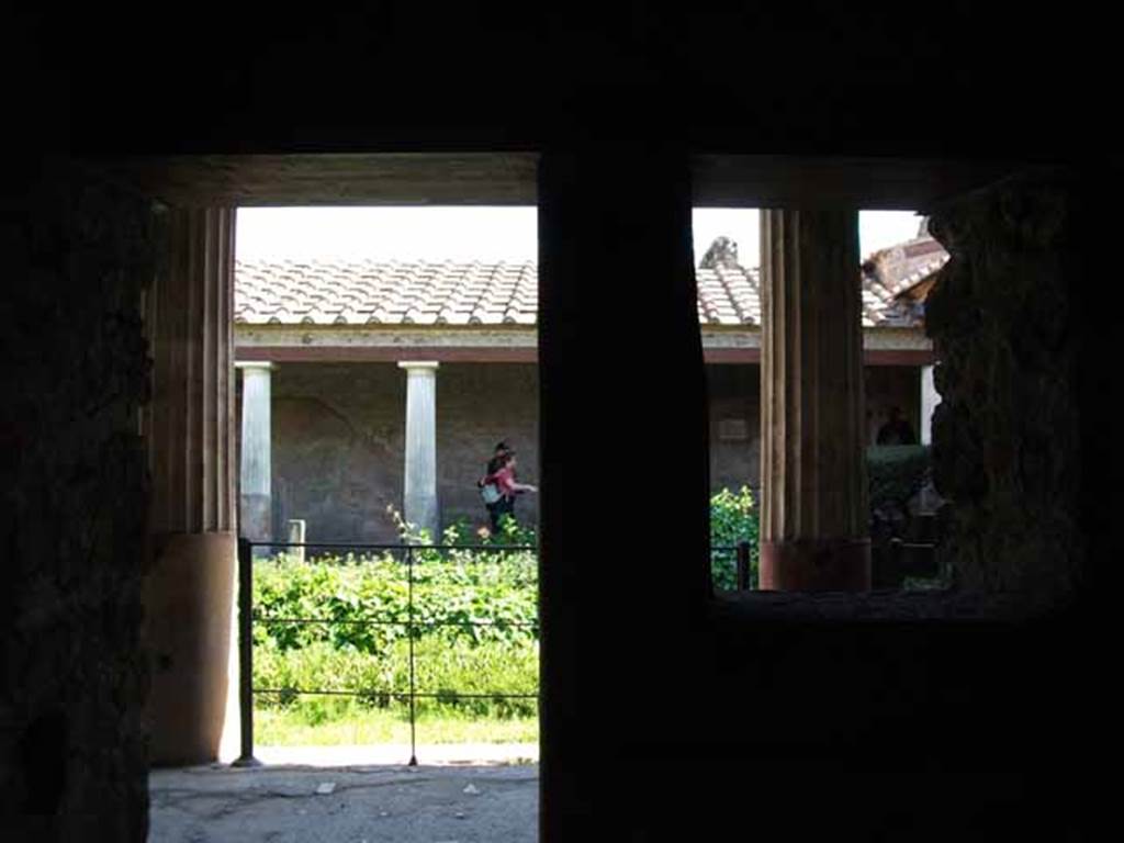 VI.16.7 Pompeii. May 2010. Room L, south wall with window and doorway to portico.