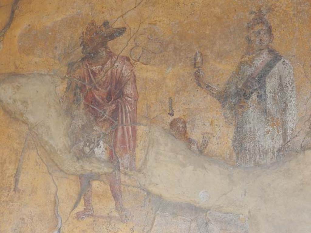 VI.16.7 Pompeii. May 2016. Room F, detail of painting of Anubis, small figure, and Isis. Photo courtesy of Buzz Ferebee.