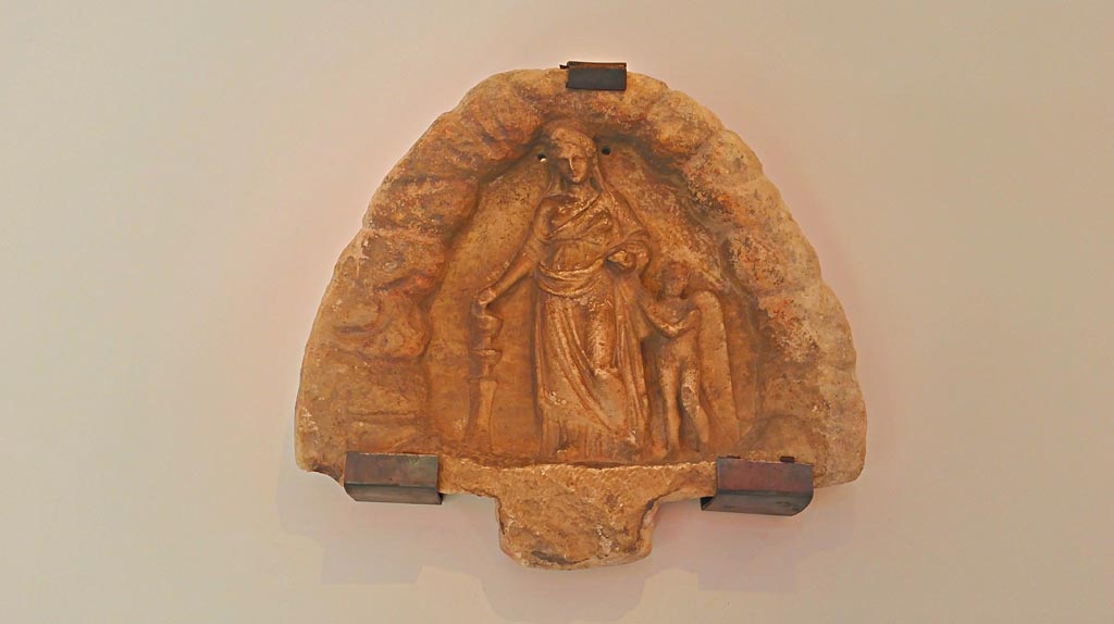 VI.16.7 Pompeii. 2016/2017. Marble votive relief with Aphrodite and Eros. (Late 4th century BC). Photo courtesy of Giuseppe Ciaramella.