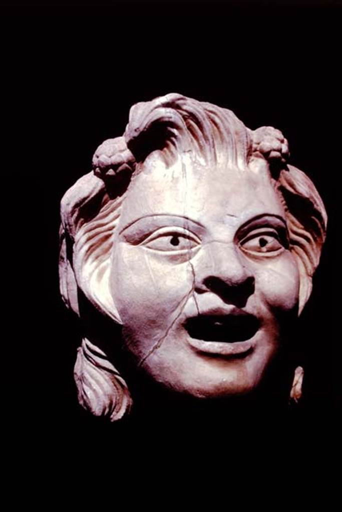 VI.16.7 Pompeii, 1978. Marble mask of a youthful satyr. Photo by Stanley A. Jashemski.
Source: The Wilhelmina and Stanley A. Jashemski archive in the University of Maryland Library, Special Collections (See collection page) and made available under the Creative Commons Attribution-Non Commercial License v.4. See Licence and use details. J78f0587
According to Wilhelmina, this youthful satyr had two clusters of ivy flowers in his hair, with his mouth somewhat open and pupils bored, with traces of colour,
(0.26m high: Pompeii inv. no: 2866).
See Jashemski, W. F., 1979. The Gardens of Pompeii. New York: Caratzas. (p.40, fig.65)
See Jashemski, W. F., 1993. The Gardens of Pompeii, Volume II: Appendices. New York: Caratzas. (p.162)