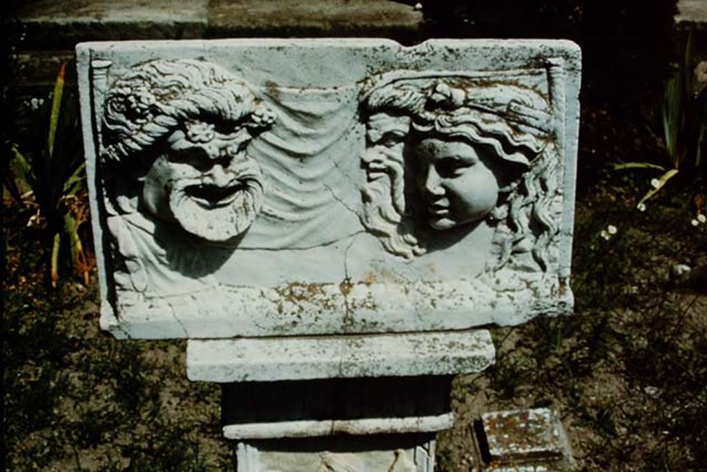 VI.16.7 Pompeii, 1968. Detail of marble relief with masks in peristyle garden, room F.
Photo by Stanley A. Jashemski.
Source: The Wilhelmina and Stanley A. Jashemski archive in the University of Maryland Library, Special Collections (See collection page) and made available under the Creative Commons Attribution-Non Commercial License v.4. See Licence and use details. J68f0203