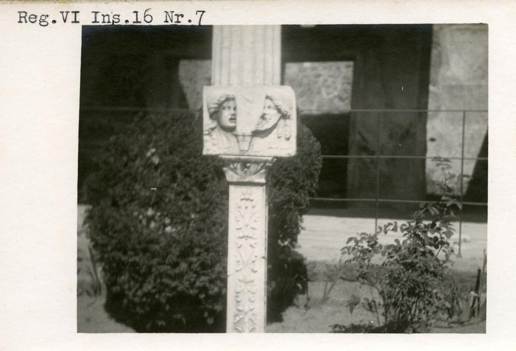VI.16.7 Pompeii. Pre-1937-39. Marble relief of two theatrical masks on a richly decorated pilaster of ivy and fruit.
Photo courtesy of American Academy in Rome, Photographic Archive. Warsher collection no. 496.