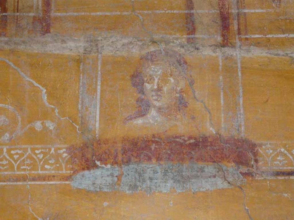 VI.16.7 Pompeii. June 2013. Room N, painting of face on east end of north wall, after restoration.
Photo courtesy of Buzz Ferebee.