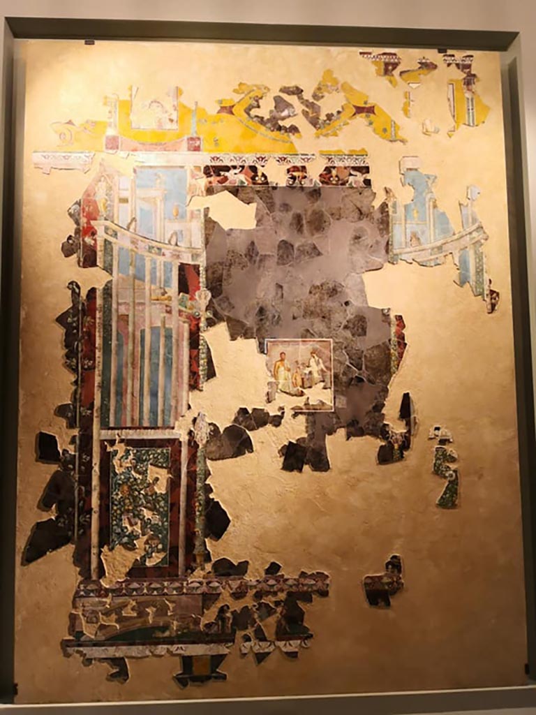 VI.17.42 Pompeii. 2019.
Recomposed fresco of architectural view and central painting of the poet Euphorion (c.30-35AD).
On display in exhibition “Pompei e Santorini” in Rome, 2019. Photo courtesy of Giuseppe Ciaramella.