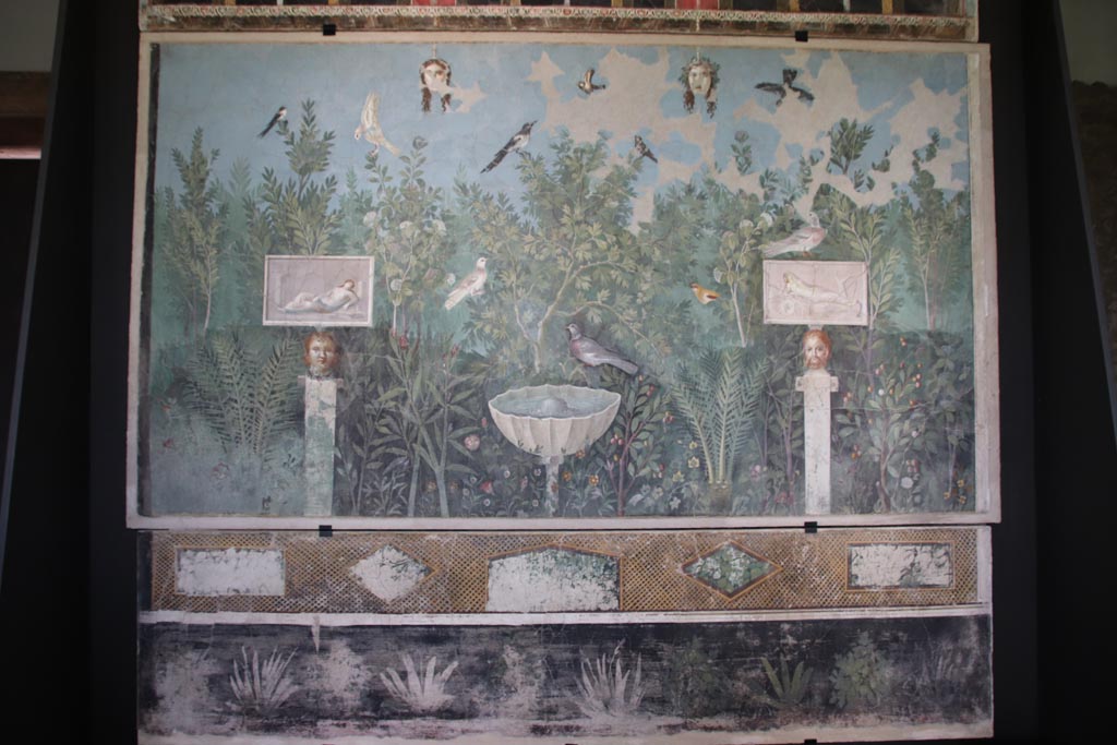 VI.17.42 Pompeii. October 2022.
Oecus 32, painted north wall from large reception room decorated with luxurious garden. On display in exhibition in Palaestra.
Photo courtesy of Klaus Heese.