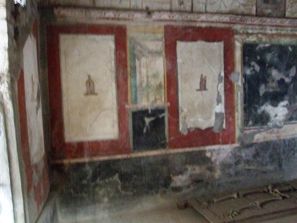 VI.17.42 Pompeii. December 2007. Second triclinium 19. West end of north wall. The panel at the west end (left) has Euterpe, the muse of lyric poetry, with writing materials. On the right is Terpsichore, the muse of dance and song, with a five string lyre supported on a small pillar. See Aoyagi M. and Pappalardo U., 2006. Pompei (Regiones VI-VII) Insula Occidentalis. Napoli: Valtrend. (p. 107).