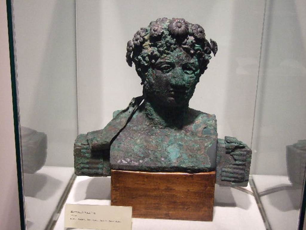 VI.17.42 Pompeii. December 2006. Bronze bust from Insula Occidentalis, (prov; Ins. Occ, Casa di Fabio Rufo).
Photographed in Boscoreale Antiquarium and Museum.