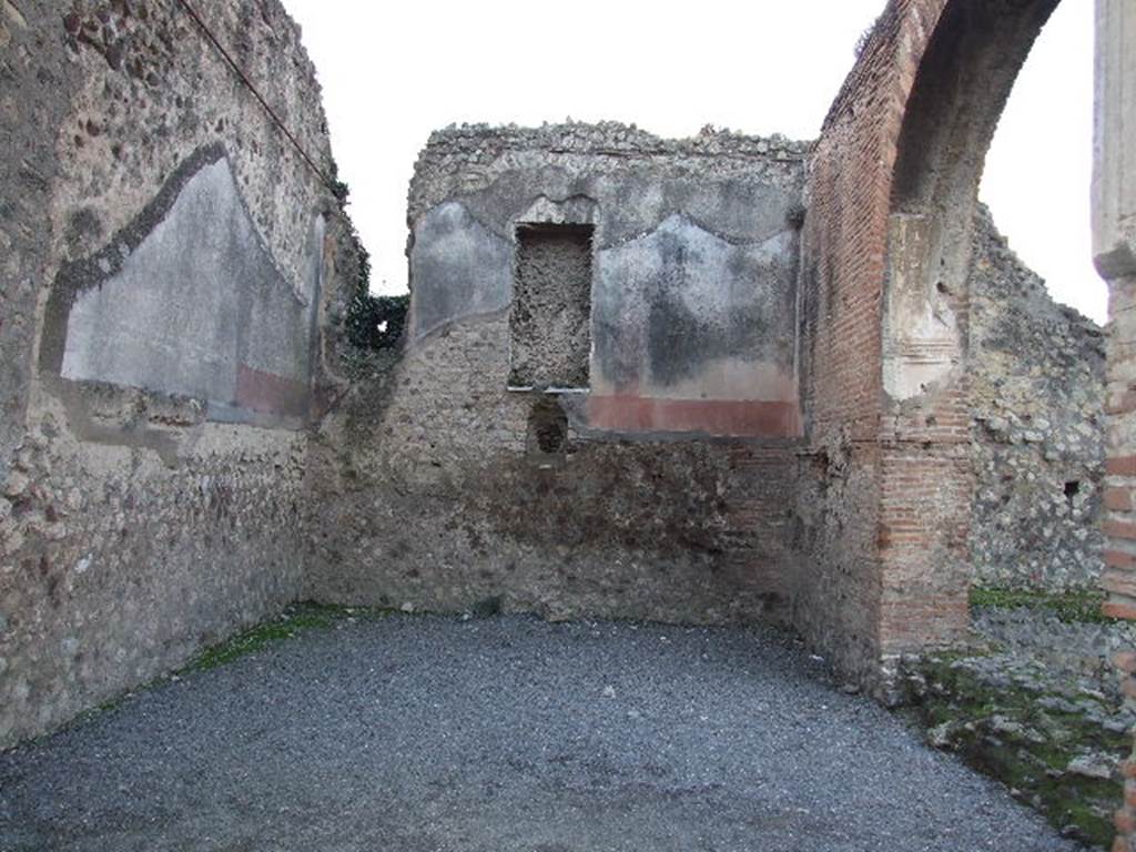 VII.1.8 Pompeii. December 2006. West, south and north walls of nymphaeum F.
The large oblong niche in the west wall was apparently for a statue. Below a jet of water spurted out just above the marble dado.
See Mau, A., 1907, translated by Kelsey F. W. Pompeii: Its Life and Art. New York: Macmillan, p. 197.