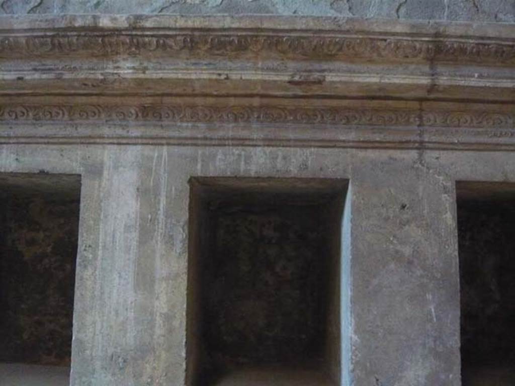 VII.1.8 Pompeii. May 2012. Detail of decoration on niches for clothing. Photo courtesy of Buzz Ferebee.