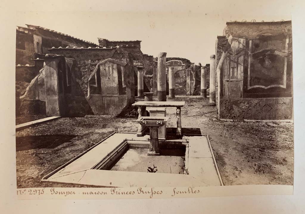 VII.1.25 Pompeii. Photograph by M. Amodio, from an album dated April 1878.
Looking west across impluvium in atrium 24 towards doorway to peristyle 31. Photo courtesy of Rick Bauer.