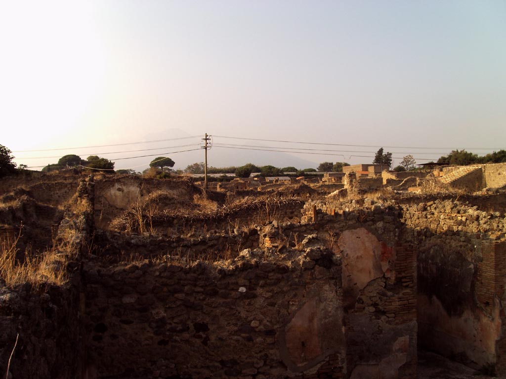 VII.1.36 Pompeii. August 2008. Looking north across rooms on west side of atrium.
The south end of the entrance corridor can be seen on the right. Photo courtesy of Jared Benton.