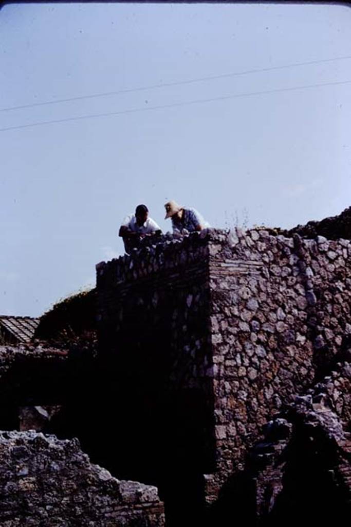 VII.1.36 Pompeii. 1966. Studying the top of the oven. Photo by Stanley A. Jashemski.
Source: The Wilhelmina and Stanley A. Jashemski archive in the University of Maryland Library, Special Collections (See collection page) and made available under the Creative Commons Attribution-Non Commercial License v.4. See Licence and use details.
J66f0647