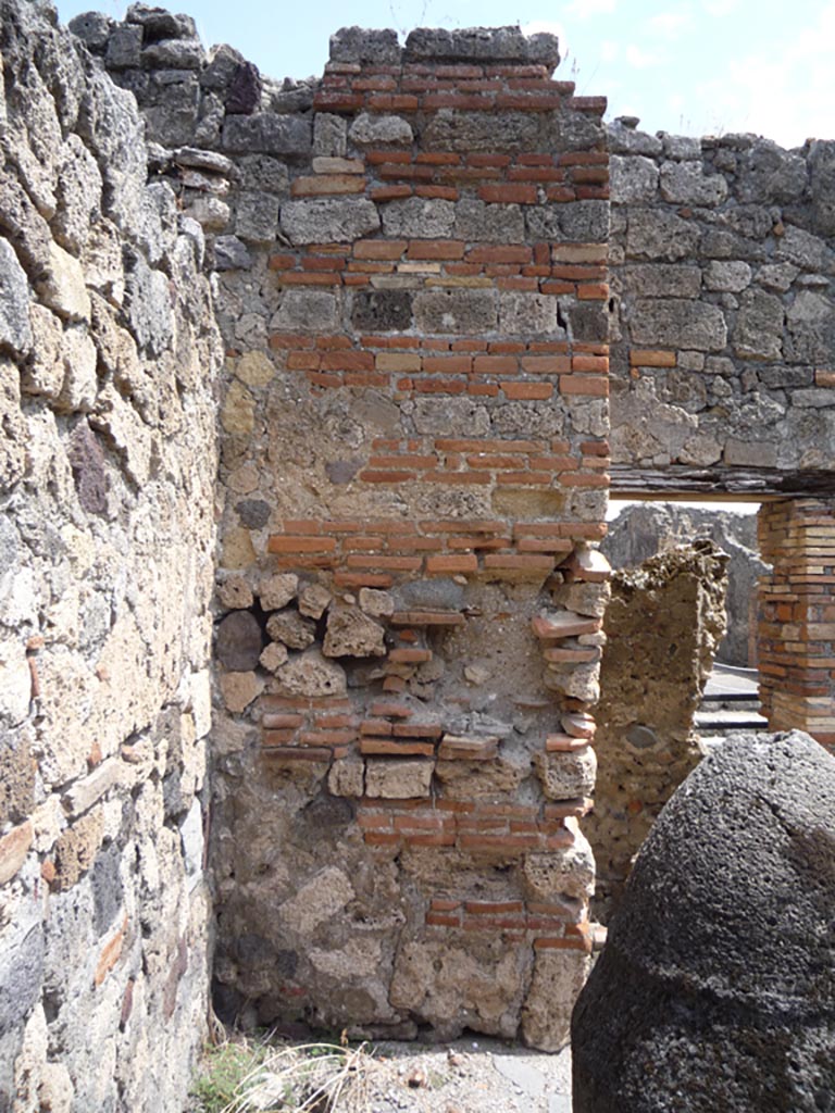 VII.1.36 Pompeii. October 2009. 
North-east corner of room, with doorway to latrine at rear. Photo courtesy of Jared Benton.
