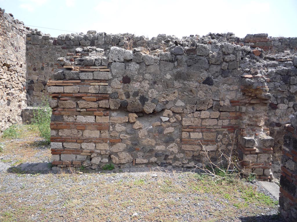 VII.1.36 Pompeii. October 2009.
Looking east in south-east corner of atrium. The doorway to the milling room is on the right. Photo courtesy of Jared Benton.