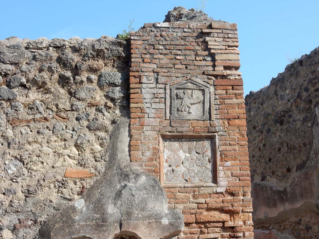 VII.1.36 Pompeii. June 2019. Plaques on east side of doorway. Photo courtesy of Buzz Ferebee.
In the Jashemski photograph of 1964 (above) these were not visible as they were covered in plaster.

