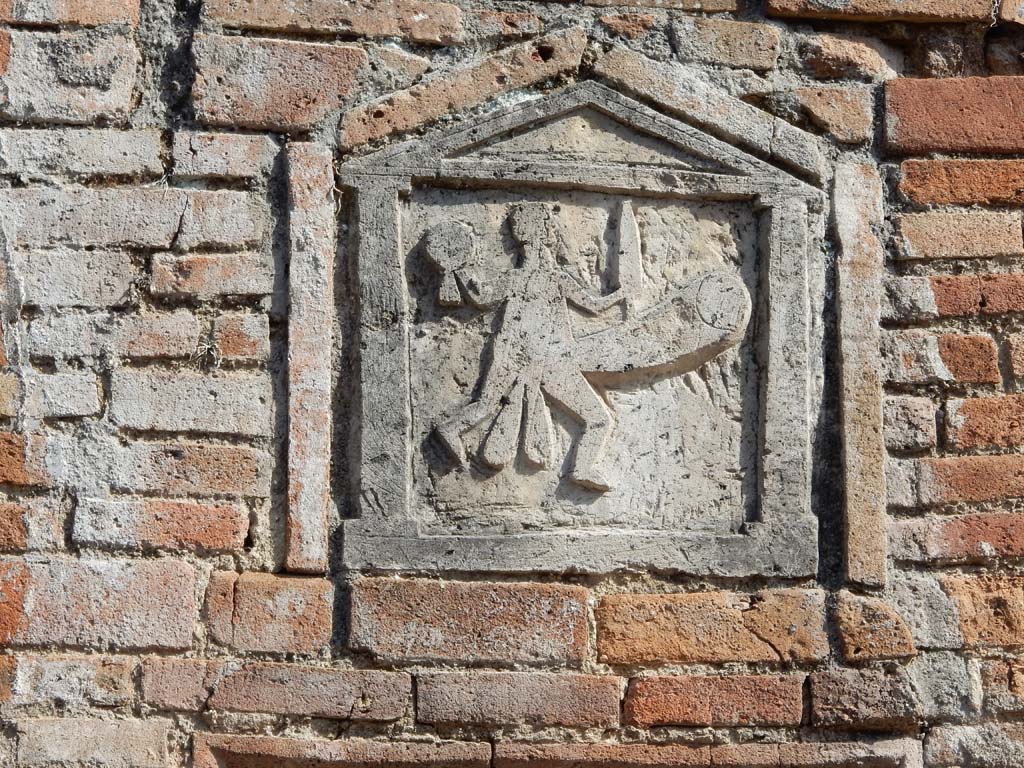 VII.1.36 Pompeii. June 2019. Detail of ithyphallic plaque. Photo courtesy of Buzz Ferebee.