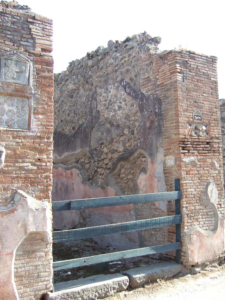 VII.1.36 Pompeii. December 2007. West side of entrance fauces and looking west along Via degli Augustali.
