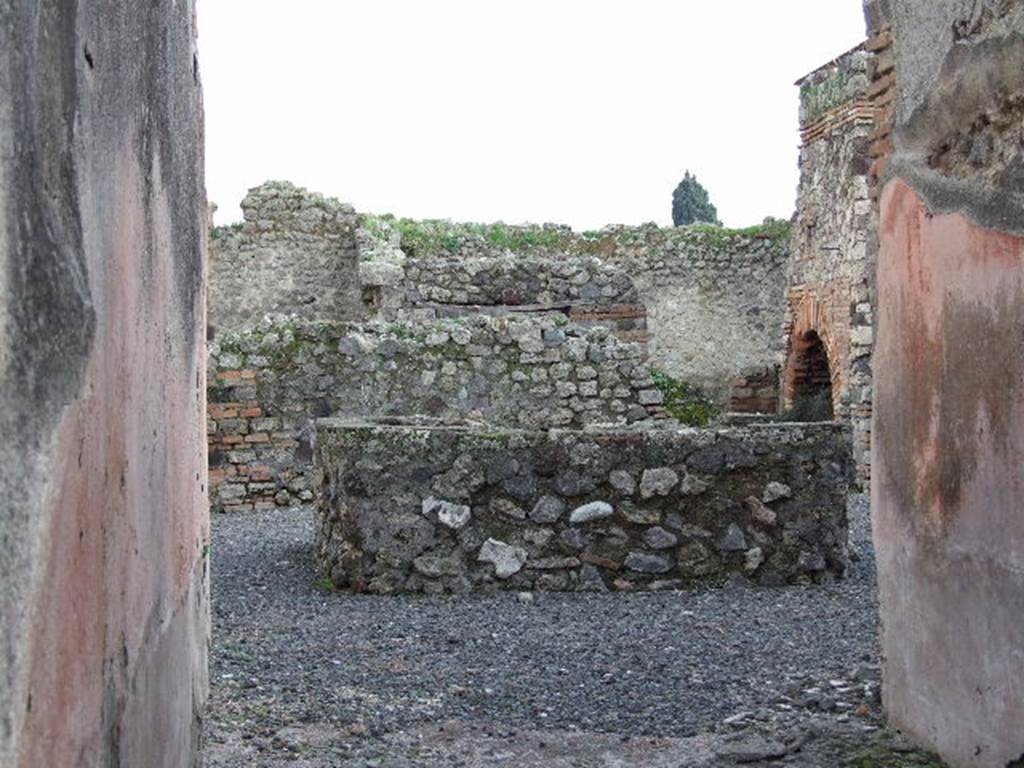 VII.1.36 Pompeii. December 2006. Looking south across atrium with large tub or basin for washing the grain, on the site of the impluvium.

