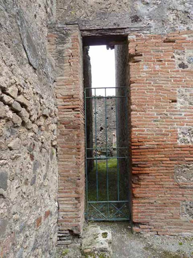 VII.1.46 Pompeii. May 2010.
Entrance to corridor 15 leading from room 16 to kitchen rooms 12, 13 and 14, and through to VII.1.47 and VII.1.25.