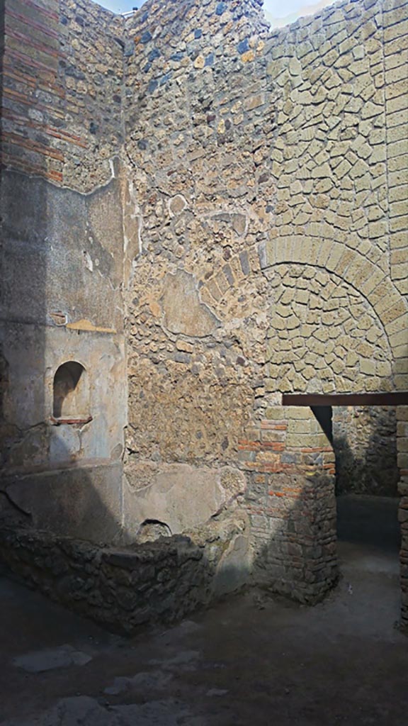 VII.1.46, Pompeii. May 2017.
Looking north-west across kitchen area 12 to niche lararium 14 built into west wall above a basin/tank.
On the right is the doorway into room 13. Photo courtesy of Giuseppe Ciaramella.