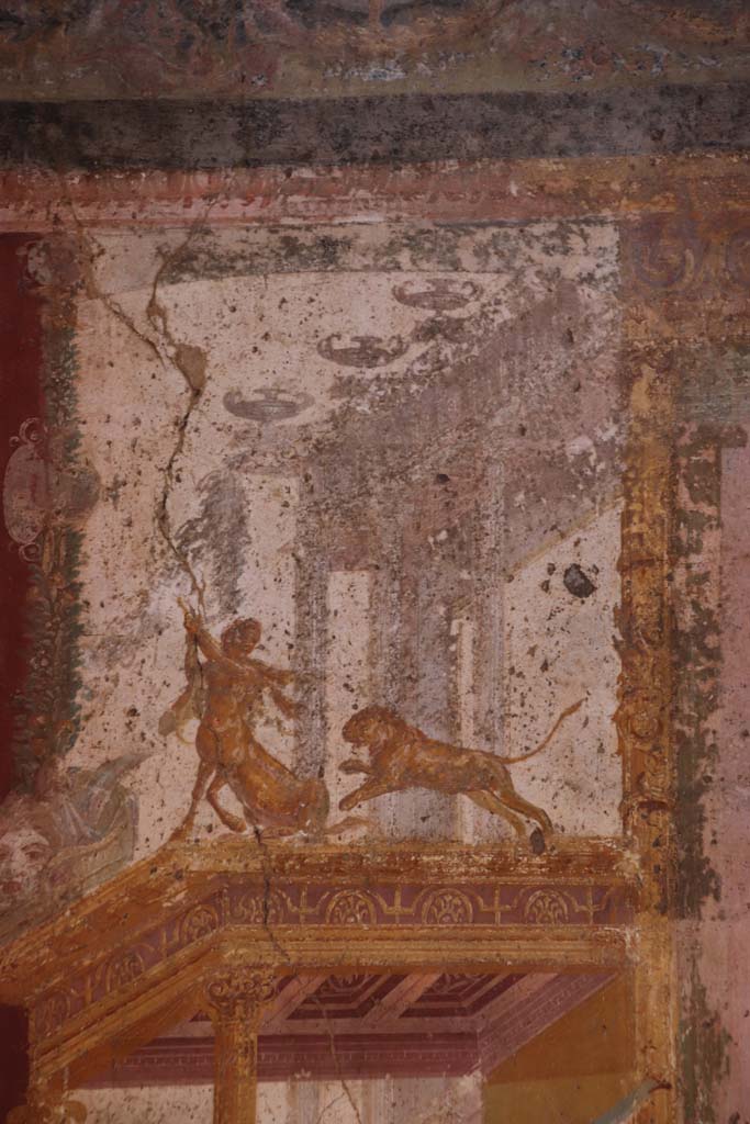 VII.1.47 Pompeii. September 2021.
Exedra 10, detail showing Centaur and Lion from north wall at west end. Photo courtesy of Klaus Heese.