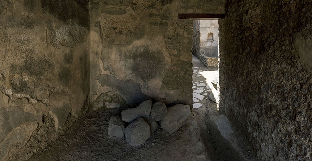 VII.1.47 Pompeii. 2017. Room 17, with doorway on right looking west towards room 12, and lararium in VII.1.46.
Photo courtesy of John Puffer.