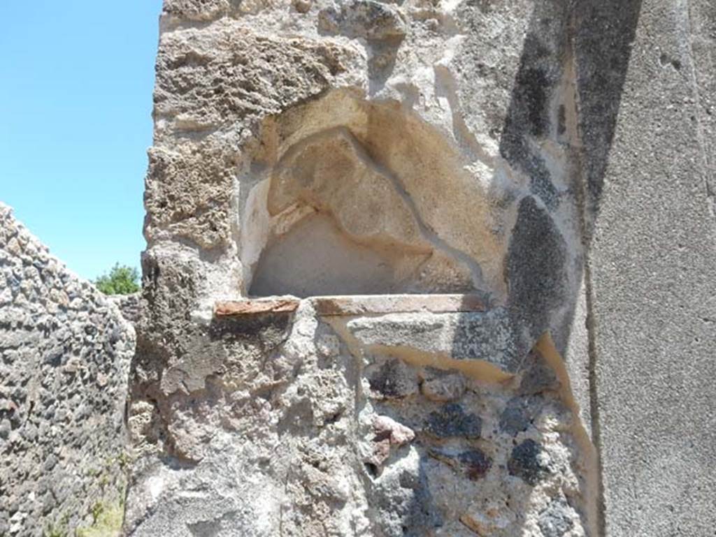 VII.1.47 Pompeii. May 2017. Looking east at niche on south side of doorway into room on north-east side of peristyle 19.
Photo courtesy of Buzz Ferebee.