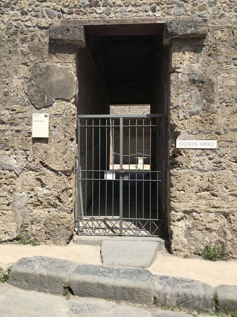VII.1.47 Pompeii. April 2019. Looking east to entrance doorway on Vicolo del Lupanare.
Photo courtesy of Rick Bauer.