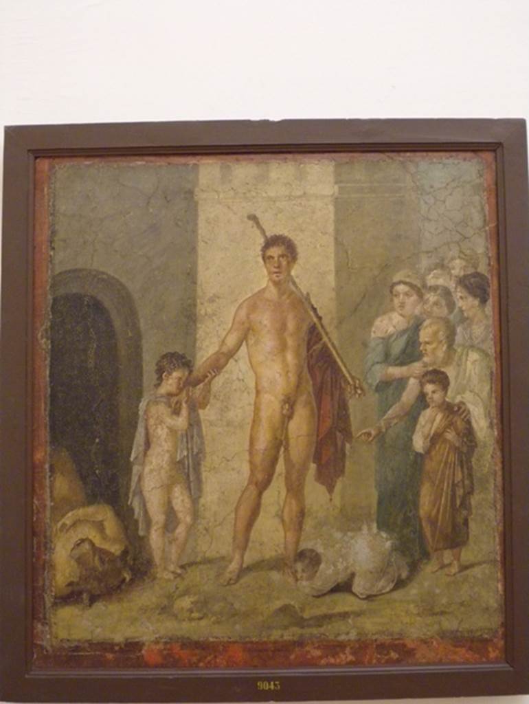 VII.2.16 Pompeii.  Room 17.  Exedra.  East wall.  Wall painting of Theseus being honoured by the Athenians after killing the Minotaur who lies on the ground.  Now in Naples Archaeological Museum.  Inventory number: 9043.