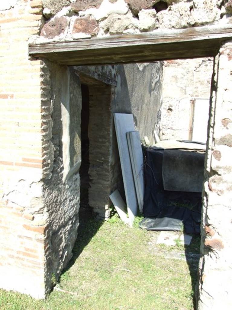 VII.2.16 Pompeii. March 2009. Doorway in north portico, leading to atrium, and with side door to room 20, triclinium.