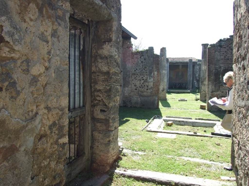 VII.2.16 Pompeii. March 2009. Looking south across atrium from entrance fauces. The door to room 1, is on the east side (the left).
