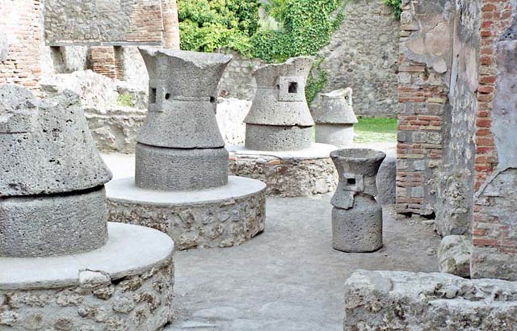 VII.2.22 Pompeii. October 2001. Looking east along mills in bakery. Photo courtesy of Peter Woods.